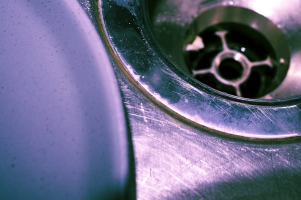 Stainless steel sink drain closeup for drain cleaning service